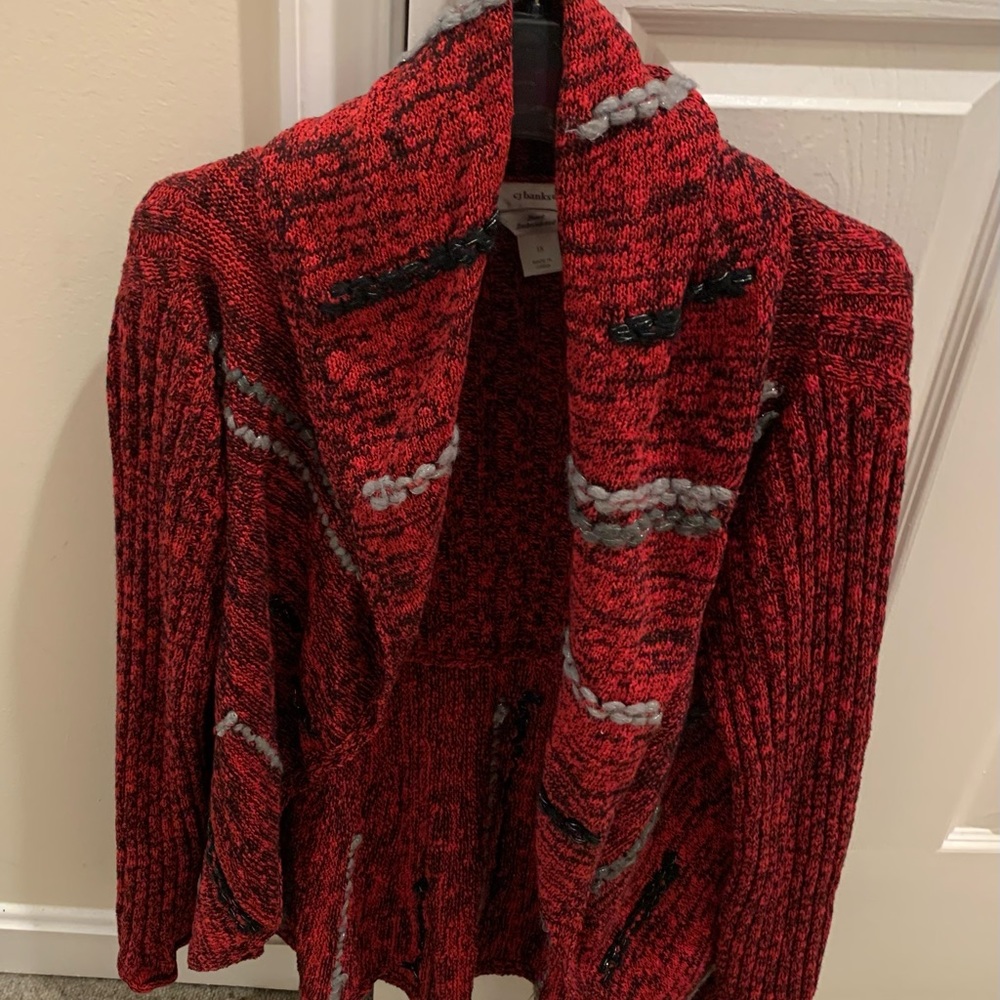 Hand embroidered red cardigan with black and gray accents.